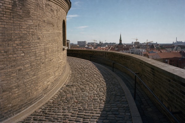 Children climbing the wide spiral ramp inside the Round Tower in central Copenhagen