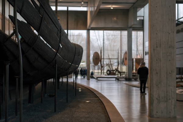 Viking-era weapons and silver artefacts displayed in a national history museum hall